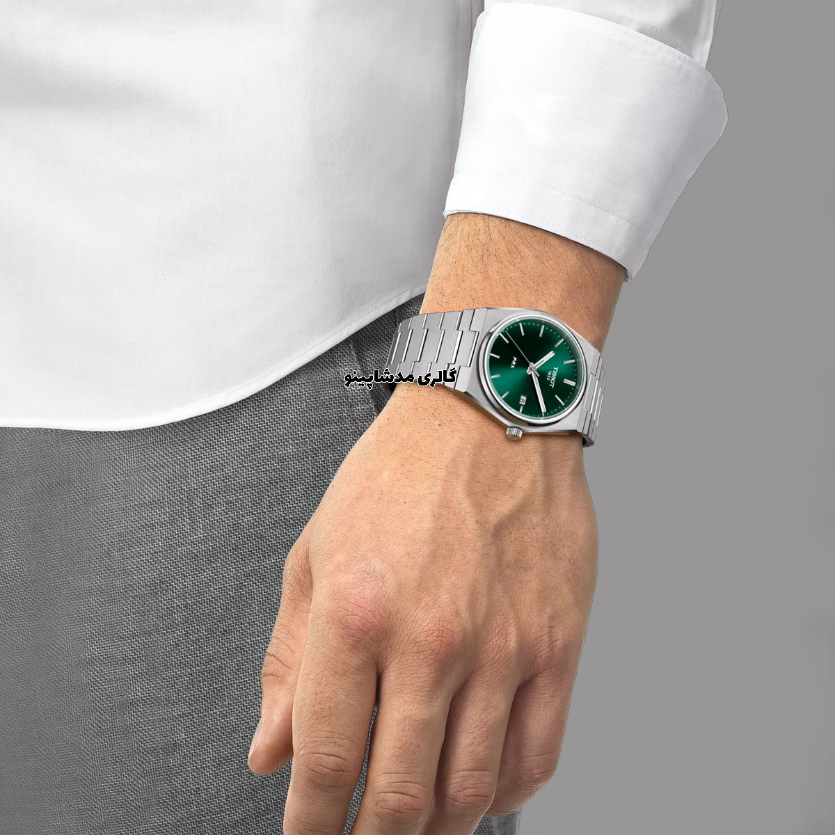 Tissot-men's-green-dial-watch-on-hand ساعت تیسوت صفحه سبز مردانه