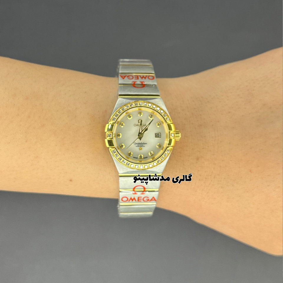 omega-constellasion-diamond-for-women-1 ساعت امگا زنانه دورنگین طلایی سیلور